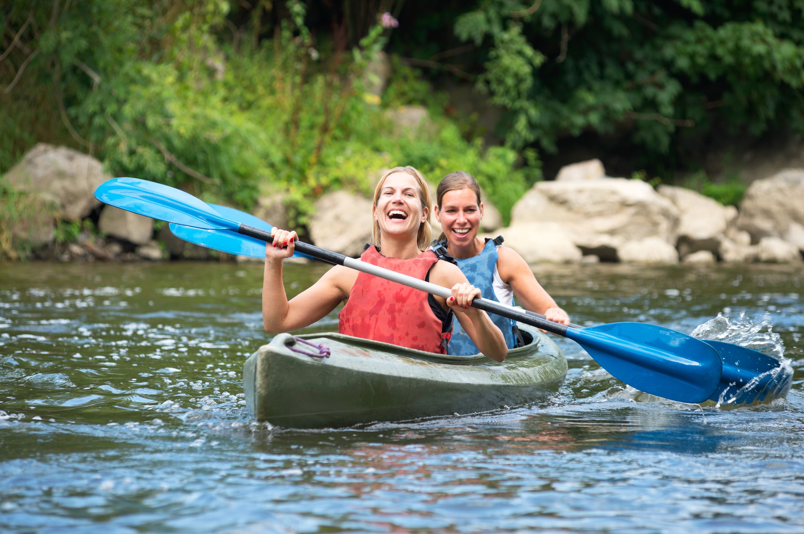 An image of two women kayaking.