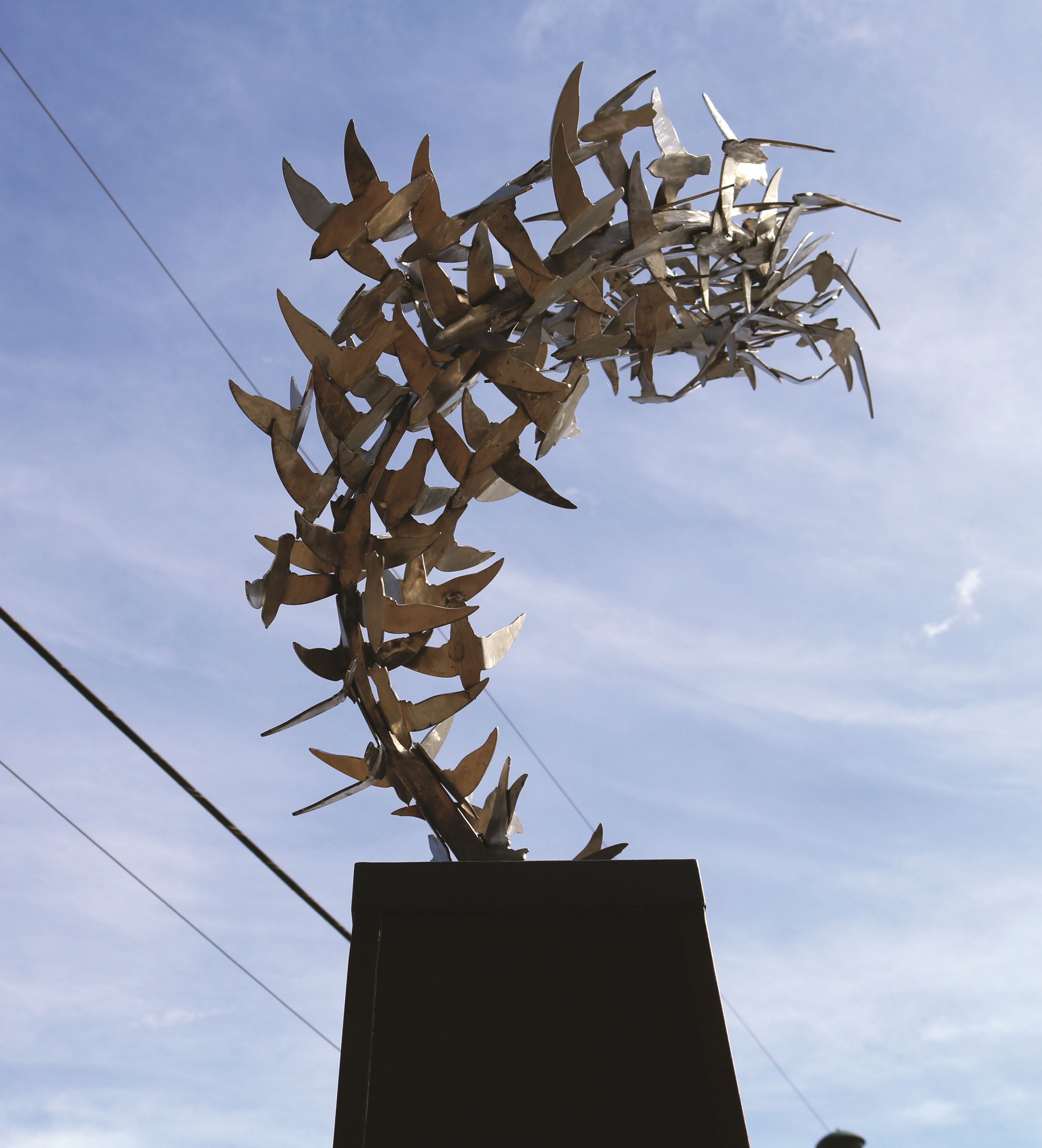 A photo of the metal swift birds on the Wagner Swifts sculpture in downtown Monroe.